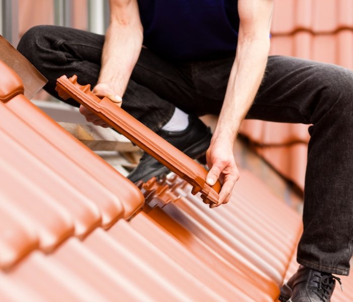 a man roofing the roof